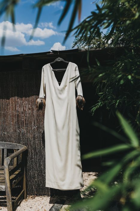White flowing Coat-Dress by Vikileria Revive, photographed outdoors at dusk